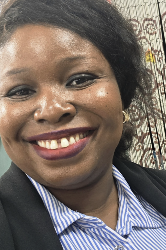 Headshot of Nneoma Onyinye Onwuegbuchi smiling at the camera