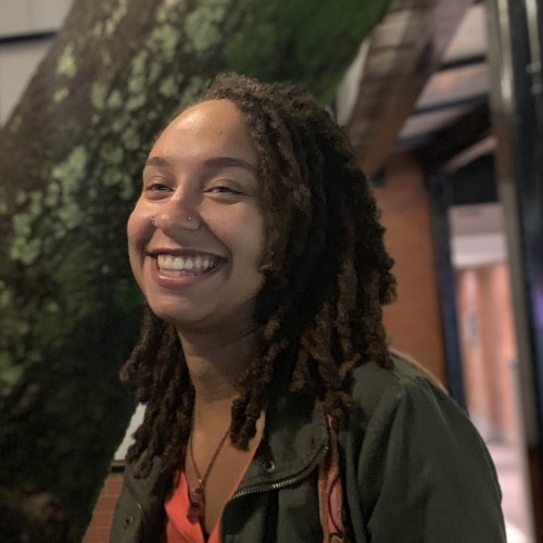 Kiana Knight smiling and looking out of frame