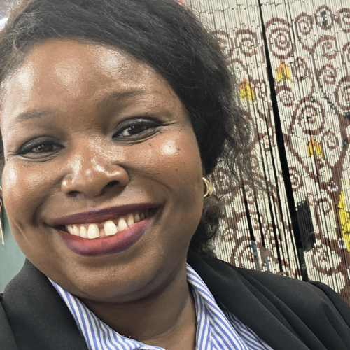 Headshot of Nneoma Onyinye Onwuegbuchi smiling at the camera