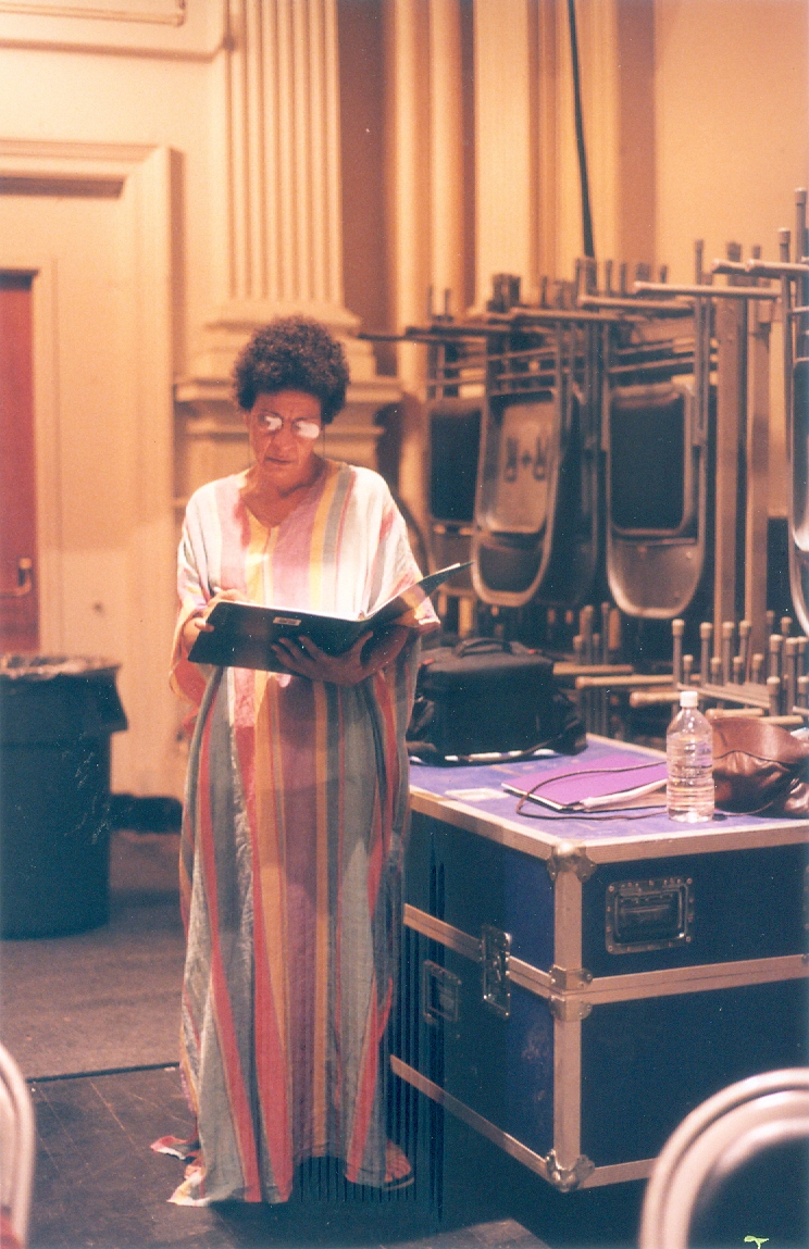 An image of actress Sylvia Ann Soares reading the script for the 1999 production of Heart to Heart.